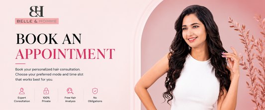 Promotional banner for Belle & Home featuring a smiling woman with long dark wavy hair on the right, set against a soft pink background with decorative branches. The left side contains the Belle & Home logo, the text 'BOOK AN APPOINTMENT,' a brief description of personalized hair consultation services, and four feature icons for expert consultation, 100% privacy, free hair analysis, and no obligations.